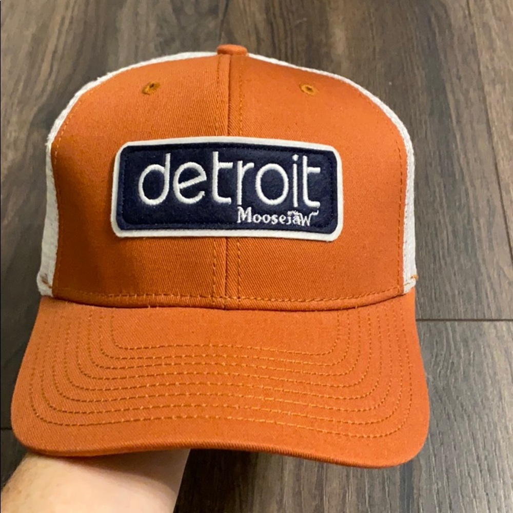 Moosejaw Detroit hat brownish orange color